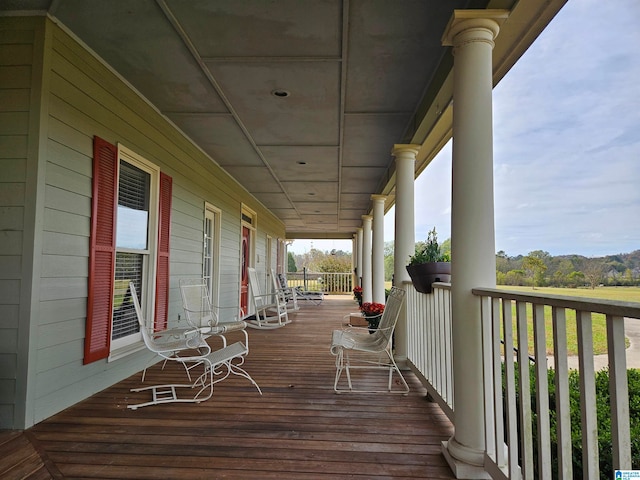 wooden terrace with a porch