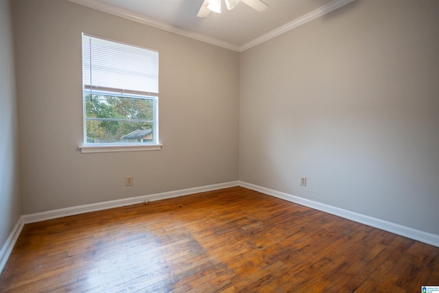 empty room featuring hardwood / wood-style floors, ceiling fan, and ornamental molding