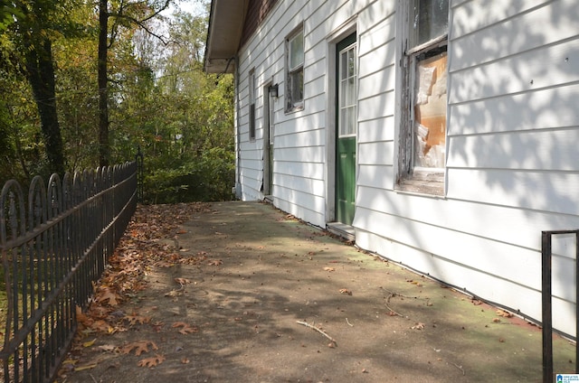 view of side of home featuring a patio area