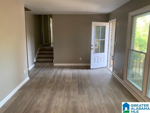 spare room featuring dark hardwood / wood-style flooring