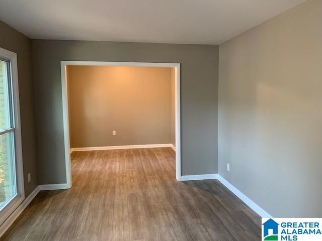 spare room with hardwood / wood-style flooring