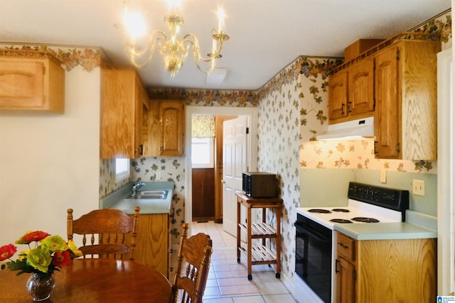 477 County Road 183, Eutaw, AL 35462 - kitchen with electric range, ventilation hood, a sink, black microwave, and a chandelier