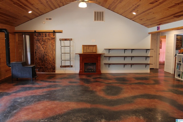 living room with lofted ceiling, a barn door, and wood ceiling