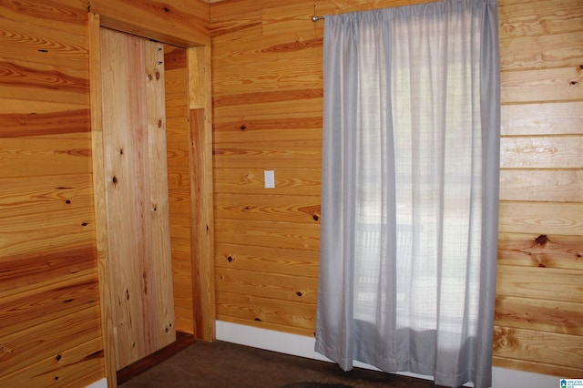 interior space featuring wood walls