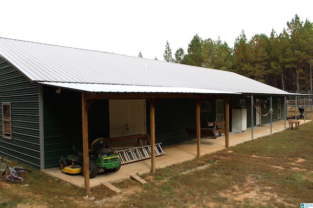 rear view of house featuring a patio