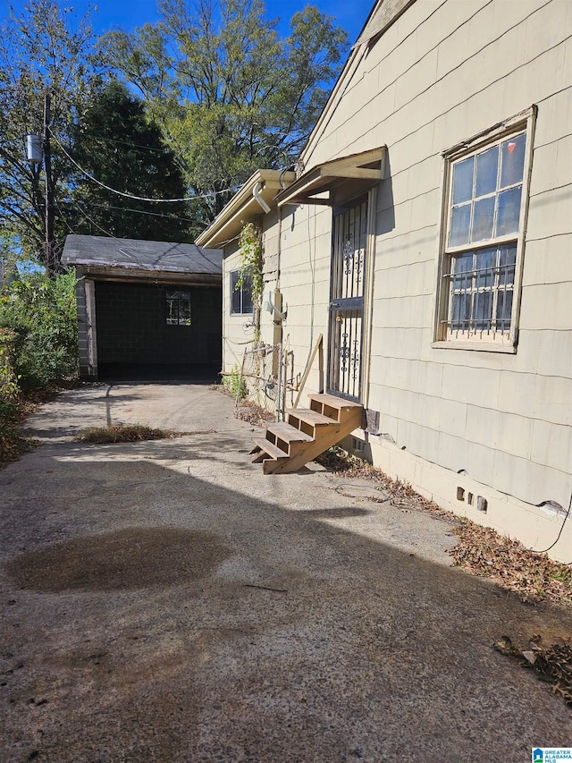 view of side of property featuring an outdoor structure