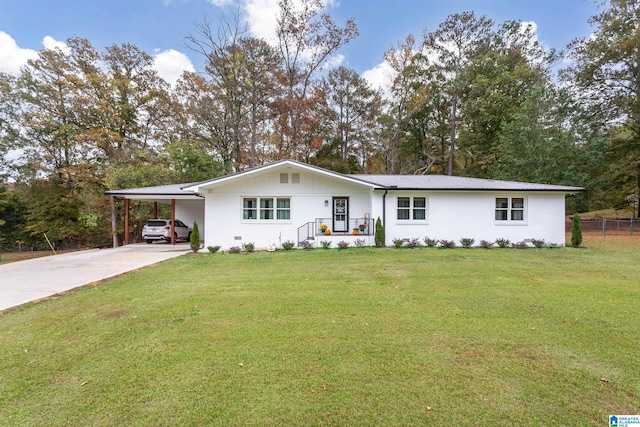 ranch-style house featuring a front lawn and a carport