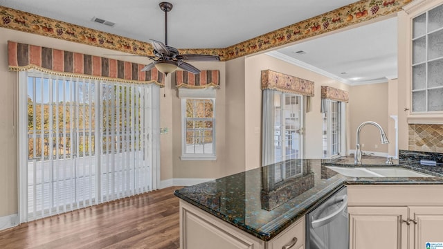 kitchen featuring white cabinetry, dishwasher, sink, and dark stone counters