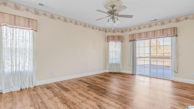 unfurnished room featuring light hardwood / wood-style floors and ceiling fan