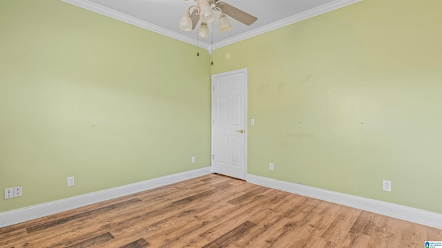 empty room featuring ceiling fan, crown molding, and hardwood / wood-style floors