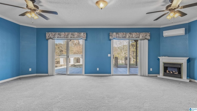 unfurnished living room featuring a textured ceiling, a wealth of natural light, a wall unit AC, and carpet floors