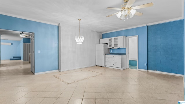 interior space with ornamental molding, ceiling fan with notable chandelier, and light tile patterned floors