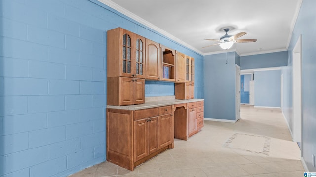 kitchen with ornamental molding and ceiling fan