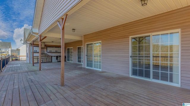 wooden deck featuring exterior kitchen