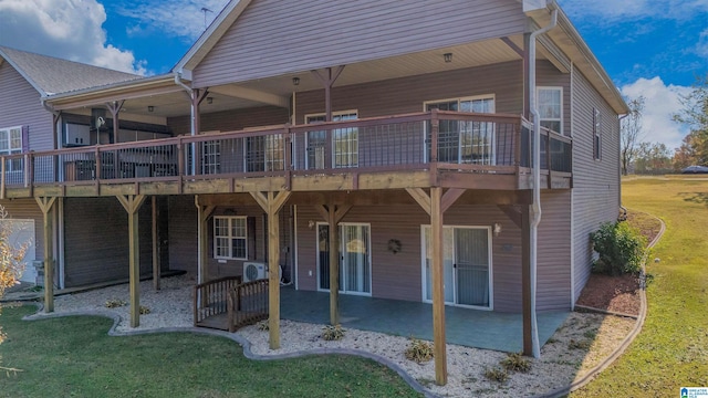 back of property featuring a yard and a patio area