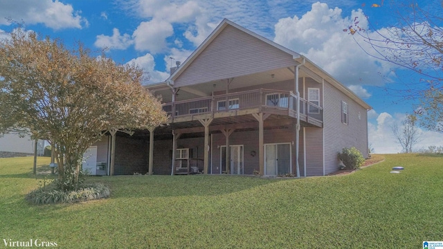 rear view of property with a yard