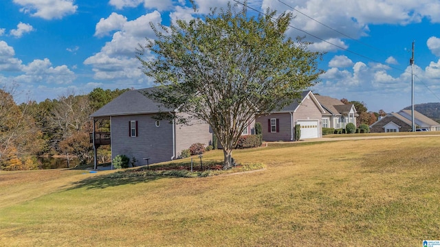 exterior space featuring a front yard and a garage