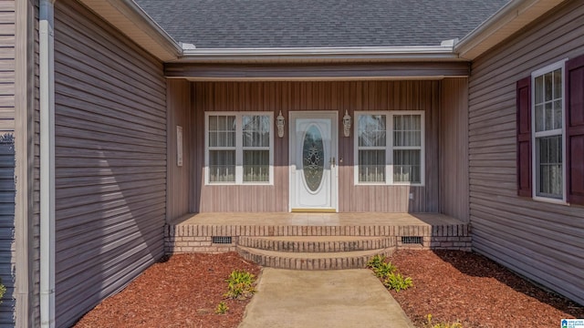 property entrance featuring a porch