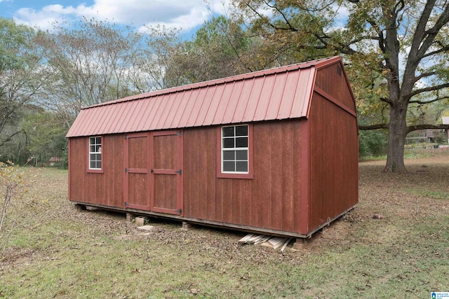 view of outdoor structure with a lawn