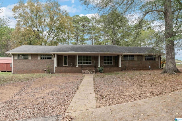 ranch-style house featuring covered porch