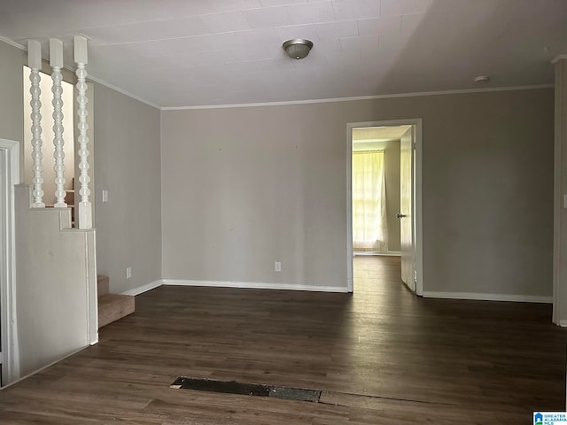 unfurnished living room with dark wood-type flooring and ornamental molding