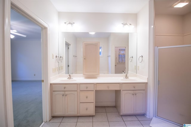 bathroom with vanity, ceiling fan, tile patterned floors, and a shower with shower door