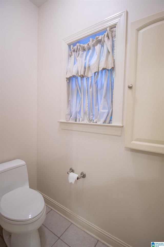 bathroom featuring tile patterned floors and toilet