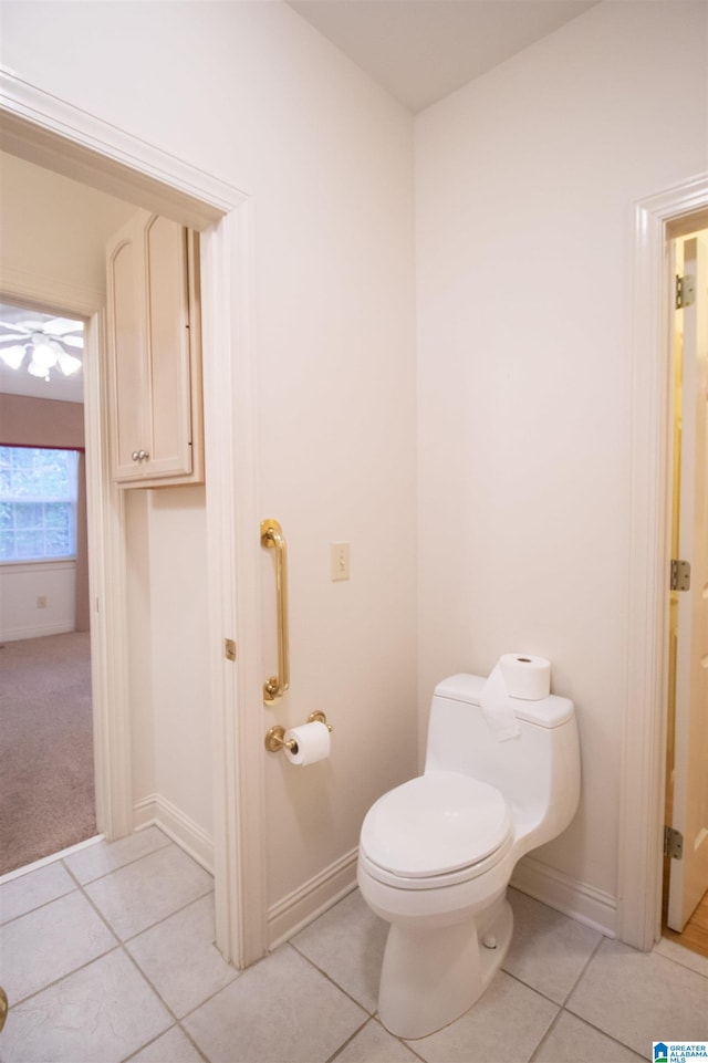 bathroom with tile patterned floors and toilet