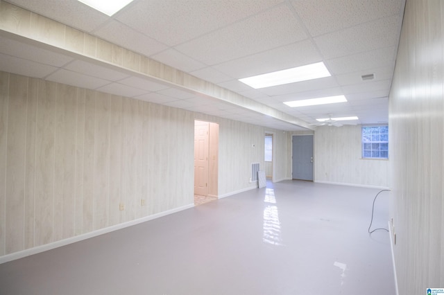 basement featuring a paneled ceiling