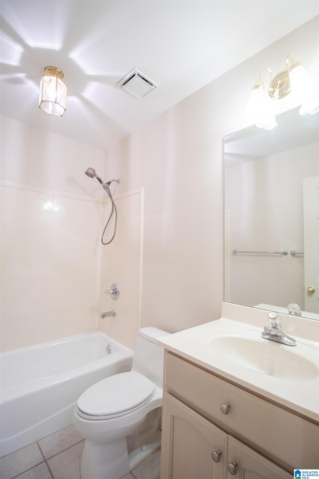 full bathroom with washtub / shower combination, tile patterned flooring, toilet, and vanity