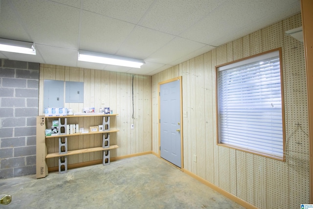 basement featuring a paneled ceiling