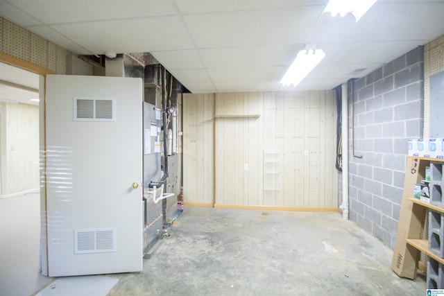 basement featuring a paneled ceiling