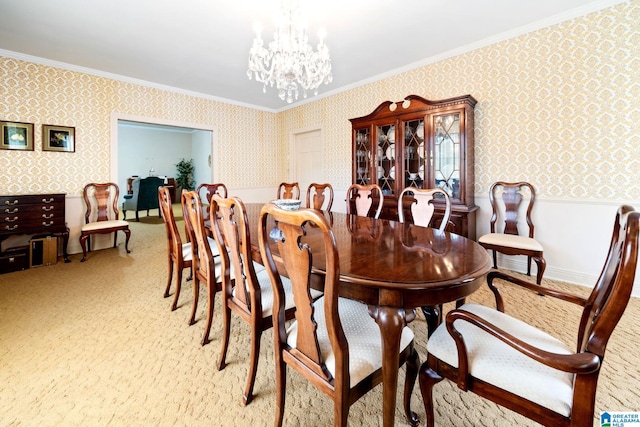 carpeted dining area featuring a chandelier and crown molding