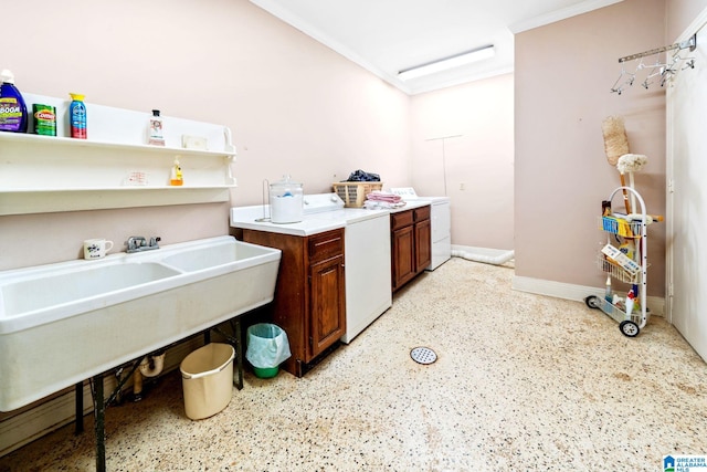 clothes washing area featuring washer / clothes dryer and ornamental molding