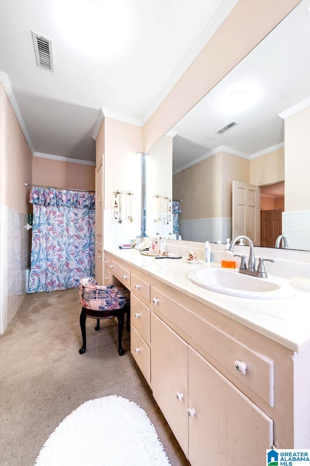 bathroom featuring ornamental molding and vanity