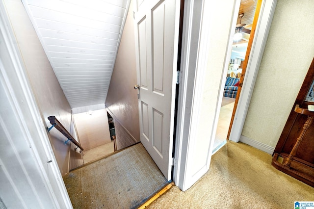 hallway with light colored carpet