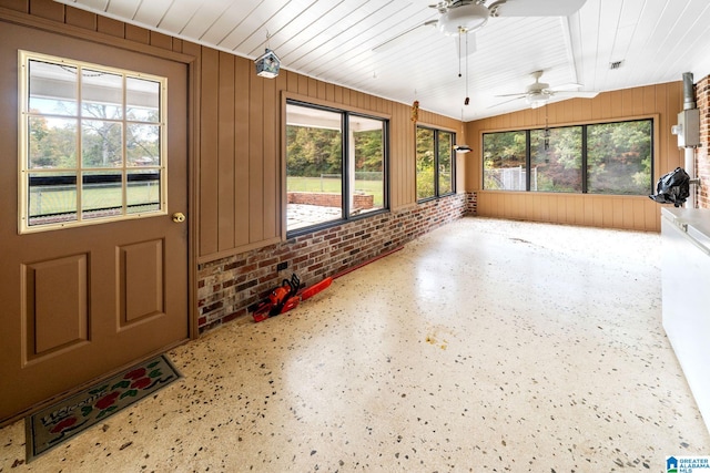 sunroom / solarium with lofted ceiling, ceiling fan, and wood ceiling