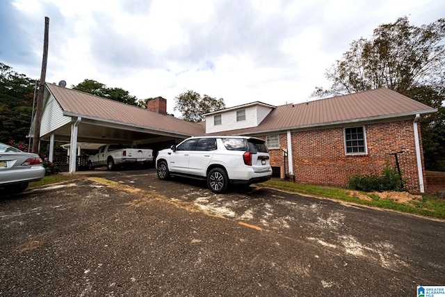 view of parking / parking lot with a carport