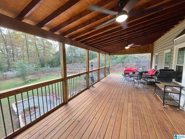 wooden deck featuring ceiling fan