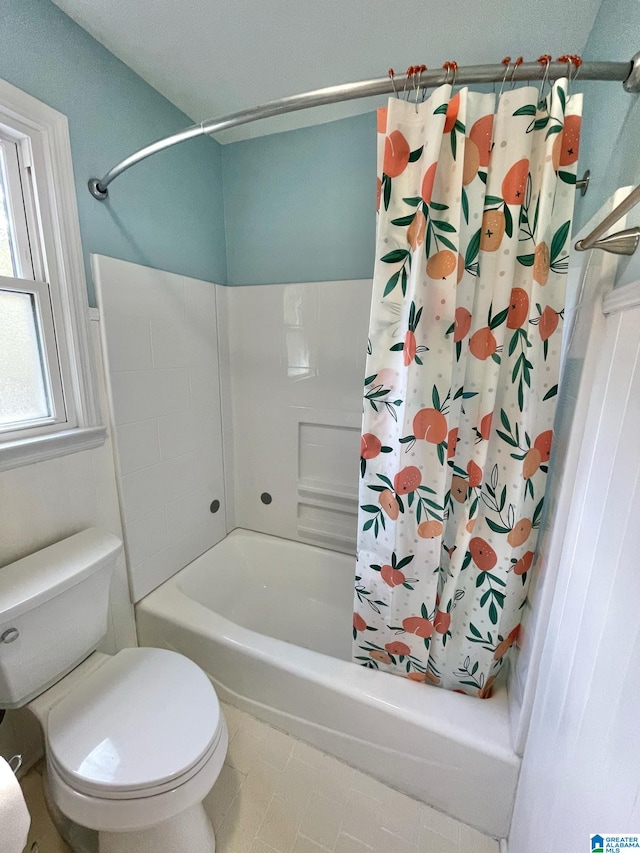 bathroom with toilet and shower / tub combo