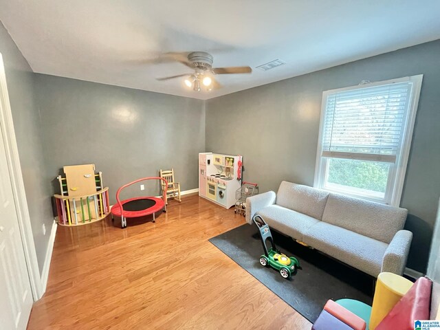 game room featuring hardwood / wood-style flooring and ceiling fan