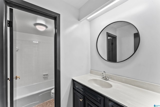 full bathroom featuring vanity, toilet, and tiled shower / bath