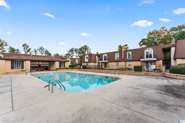 view of swimming pool with a patio area