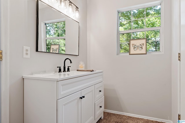 bathroom with a wealth of natural light and vanity