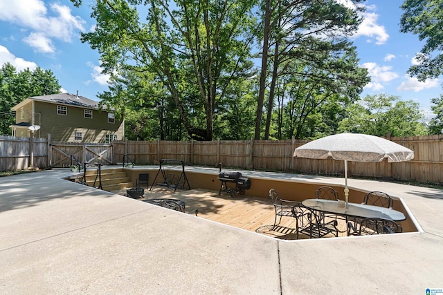 exterior space with a deck and a patio area