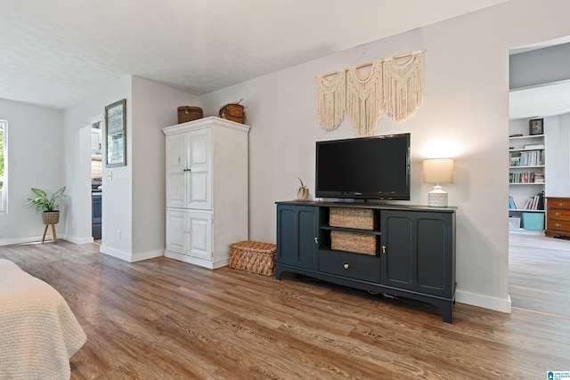 living room featuring a textured ceiling and hardwood / wood-style flooring