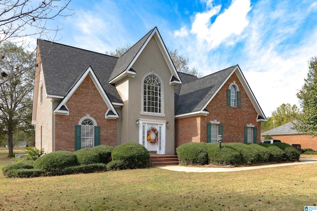 view of property featuring a front lawn