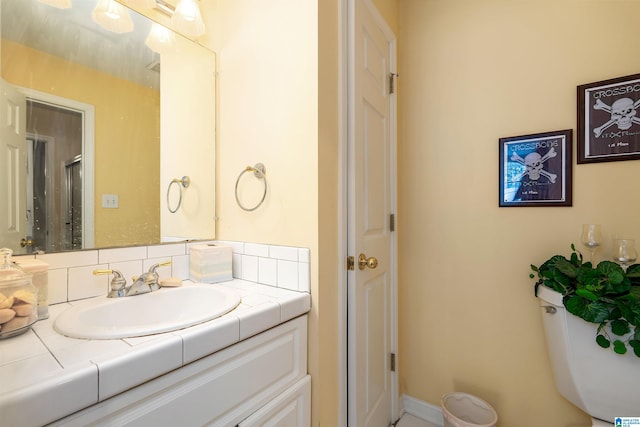 bathroom with walk in shower, backsplash, and vanity