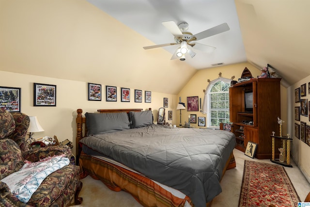 bedroom with vaulted ceiling, light carpet, and ceiling fan