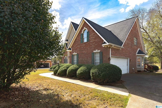 view of side of home featuring a garage